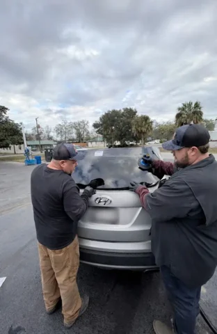 John Jr. and Chris Repairing a Rear Window at Stono River Auto Glass